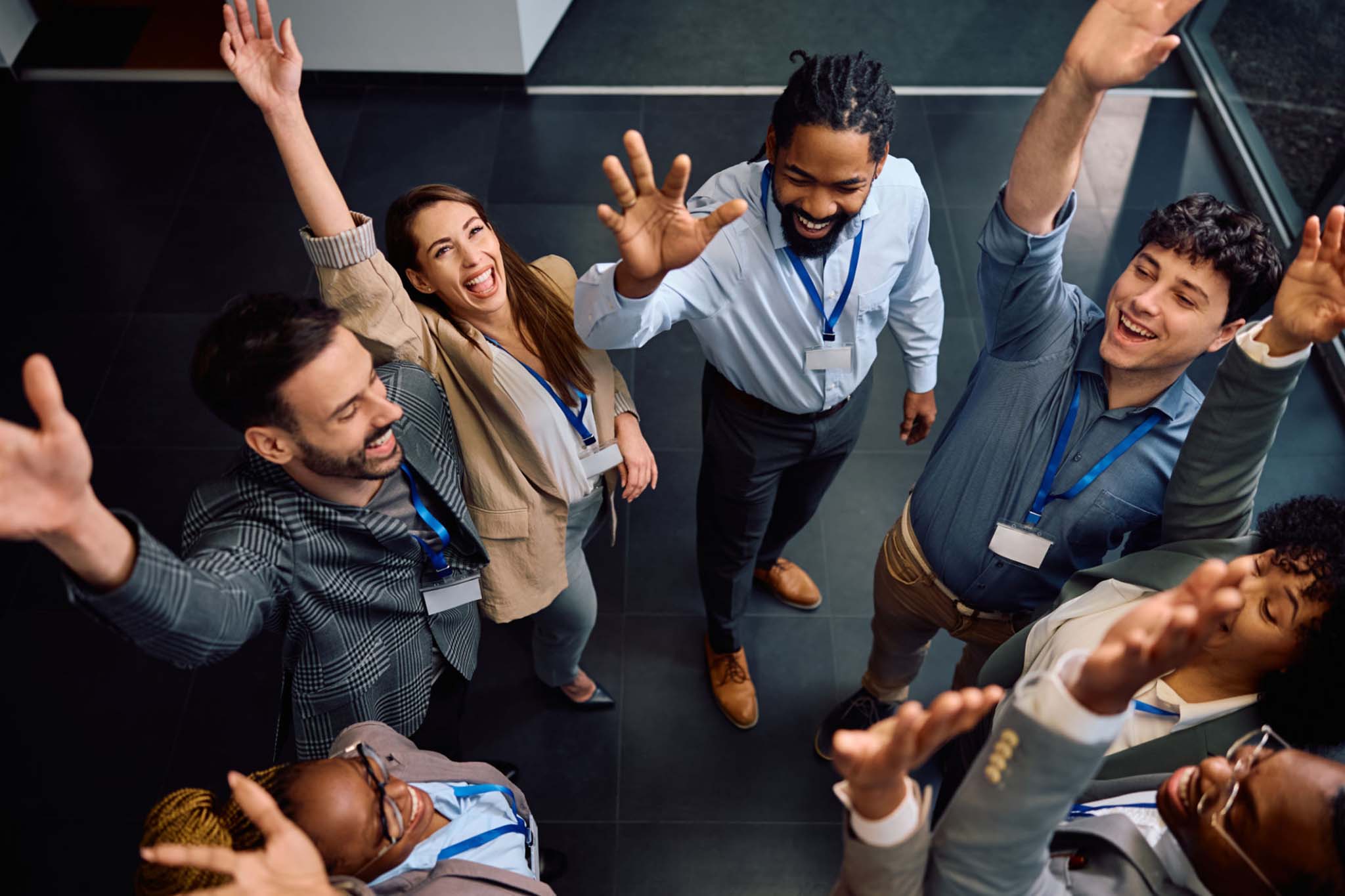Team members giving a high-five or celebrating a small success